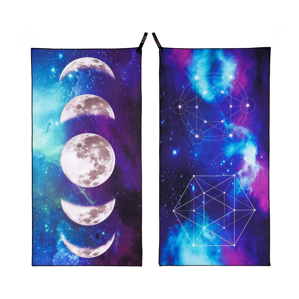 Pack towel from DryFox featuring a  cosmic design. Front of the towel displays a moon phase sequence on a purple and blue galaxy background, while the other side shows white geometric line art over a vibrant nebula of blue, purple, and pink.