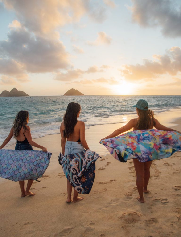 3 girls on beach with dryfoxco travel towels